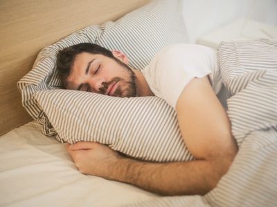 Man sleeping in bed