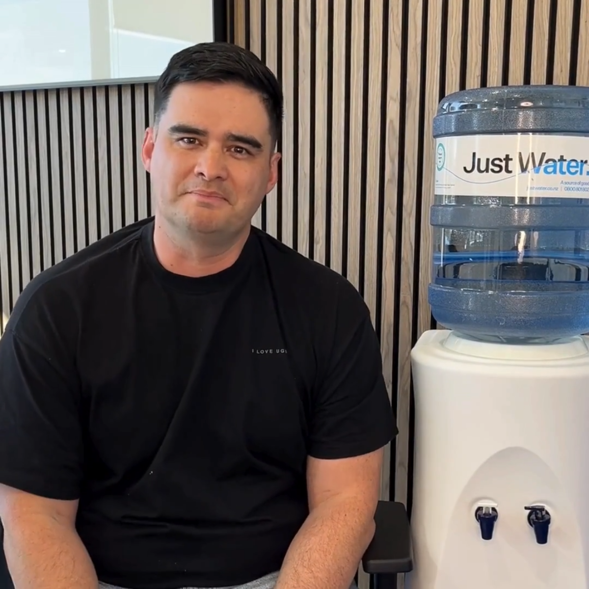 Ben explaining the difference between Fill Your Own and Water Delivery at Just Water